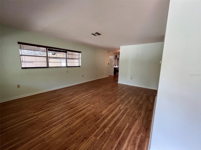 empty room with hardwood / wood-style floors