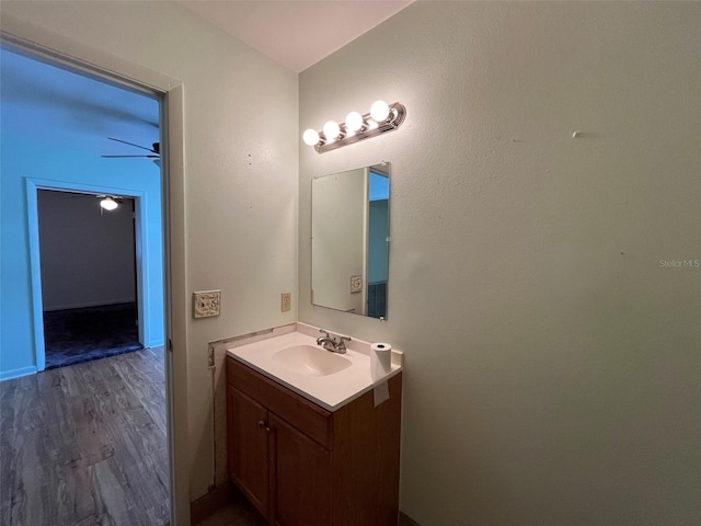 bathroom featuring ceiling fan, vanity, and hardwood / wood-style flooring