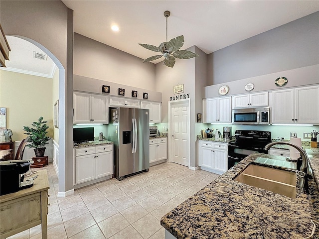 kitchen featuring white cabinets, stainless steel appliances, and sink