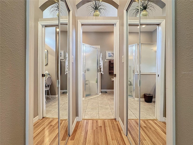 corridor with light tile patterned floors