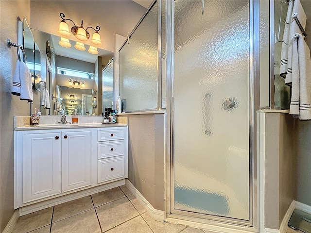 bathroom featuring tile patterned floors, vanity, and an enclosed shower