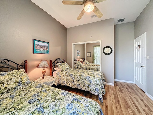 bedroom featuring light hardwood / wood-style flooring and ceiling fan