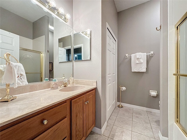 bathroom with tile patterned floors and vanity