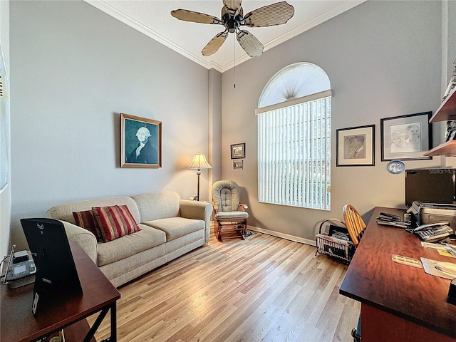 office area featuring ceiling fan, crown molding, and light hardwood / wood-style floors