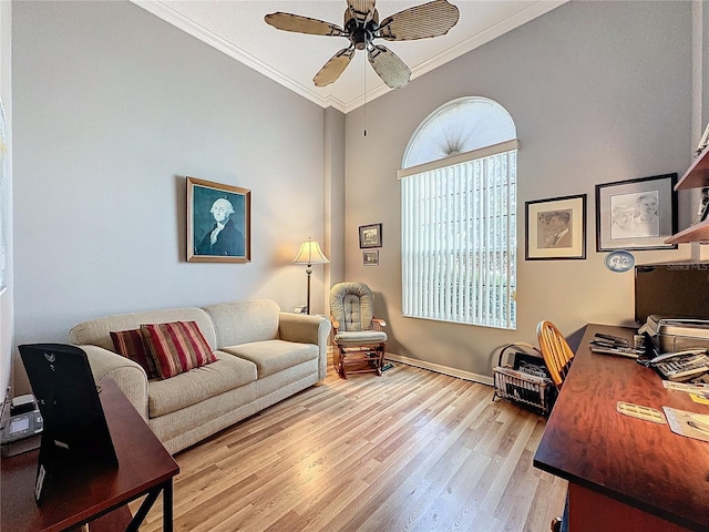 office area with crown molding, ceiling fan, and light hardwood / wood-style floors