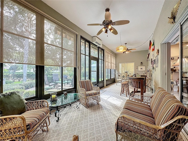 sunroom with a wall unit AC, ceiling fan, and a wealth of natural light