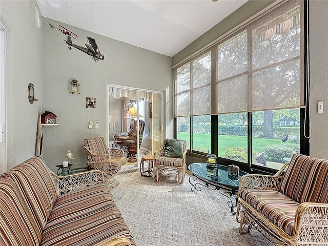 carpeted living room featuring plenty of natural light