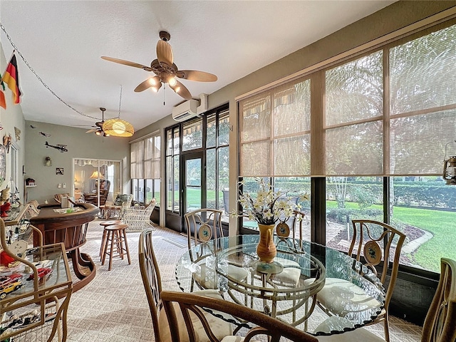 sunroom featuring ceiling fan and a wall mounted air conditioner