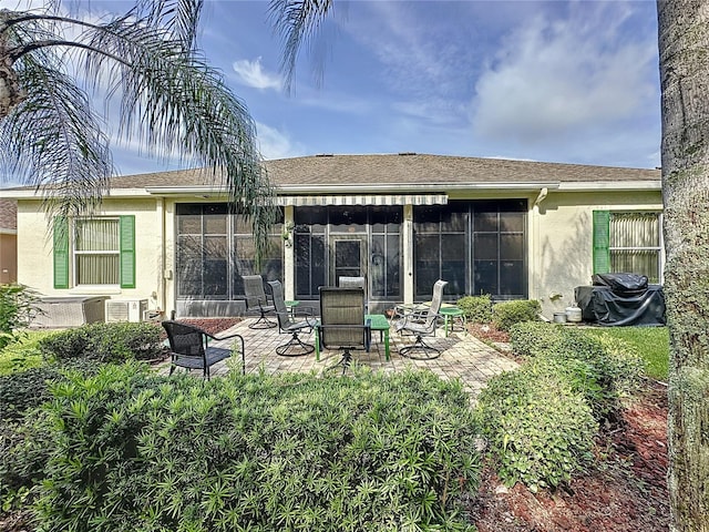 back of property featuring a patio area