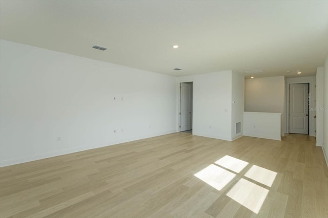 spare room featuring light wood-type flooring