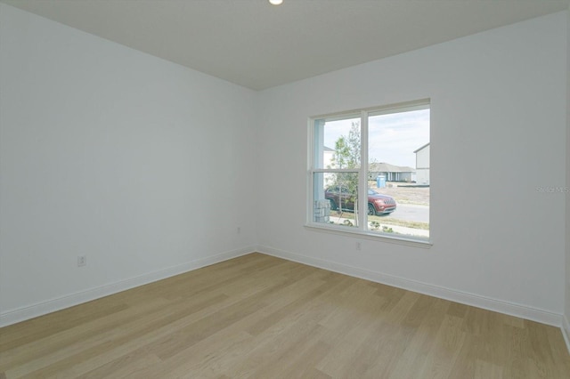 empty room with light wood-type flooring