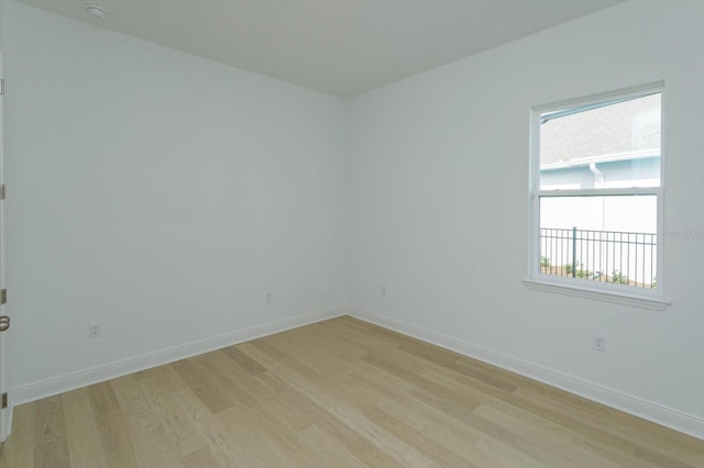 empty room with light hardwood / wood-style floors