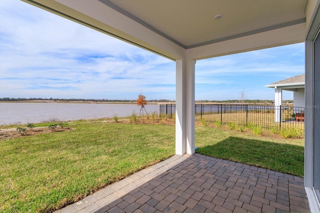 exterior space featuring a patio and a water view