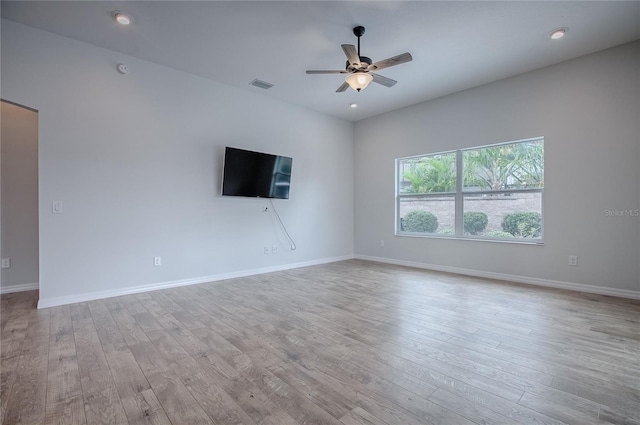 unfurnished living room with light hardwood / wood-style flooring and ceiling fan