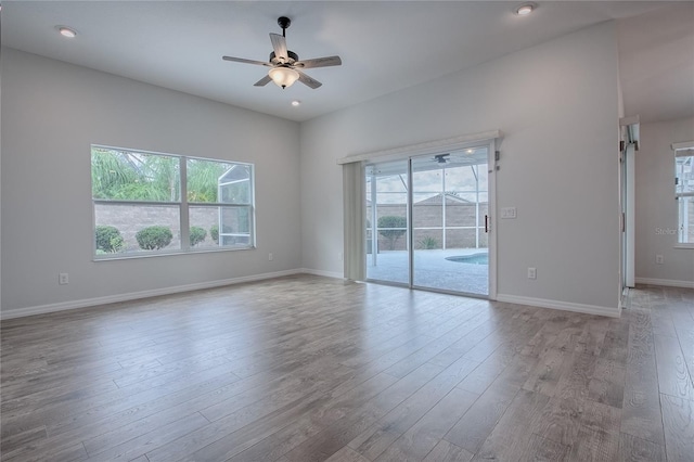 empty room featuring light hardwood / wood-style flooring and ceiling fan