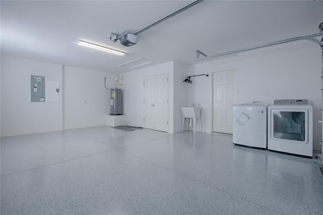 garage with sink, electric water heater, a garage door opener, electric panel, and washer and dryer