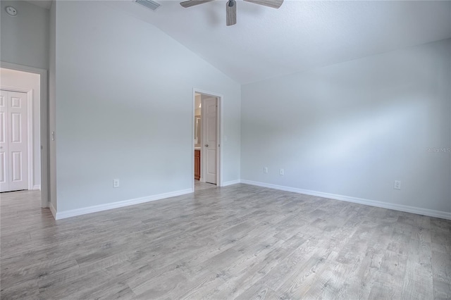 spare room featuring high vaulted ceiling, light hardwood / wood-style flooring, and ceiling fan