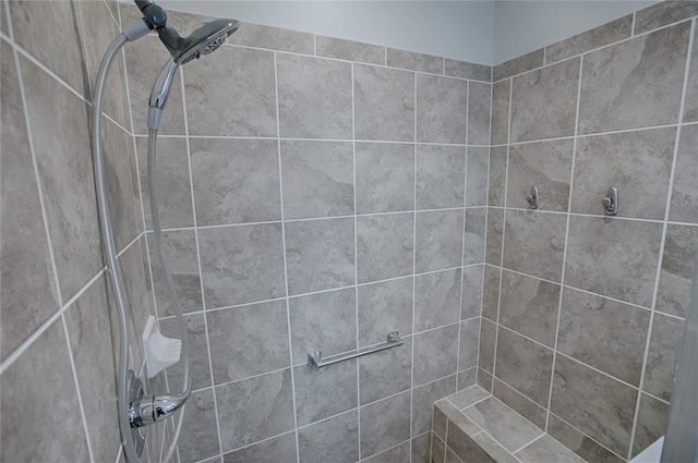 bathroom with tiled shower