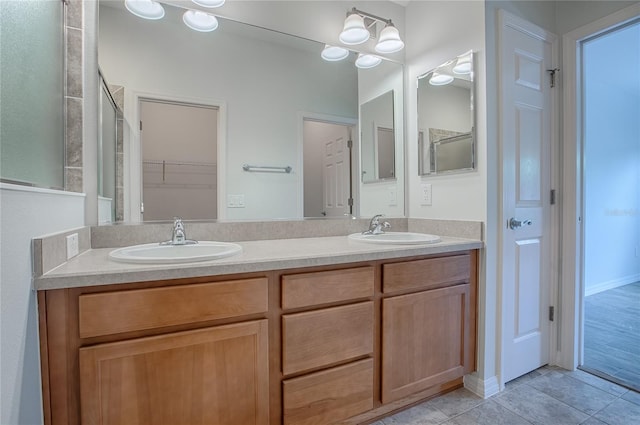 bathroom with tile patterned flooring and vanity