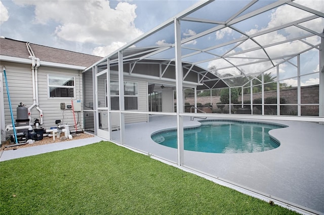 view of pool featuring a patio, a lanai, and a lawn