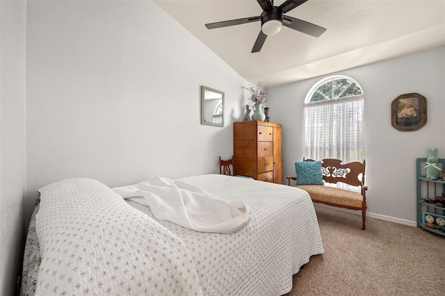 carpeted bedroom with ceiling fan and lofted ceiling