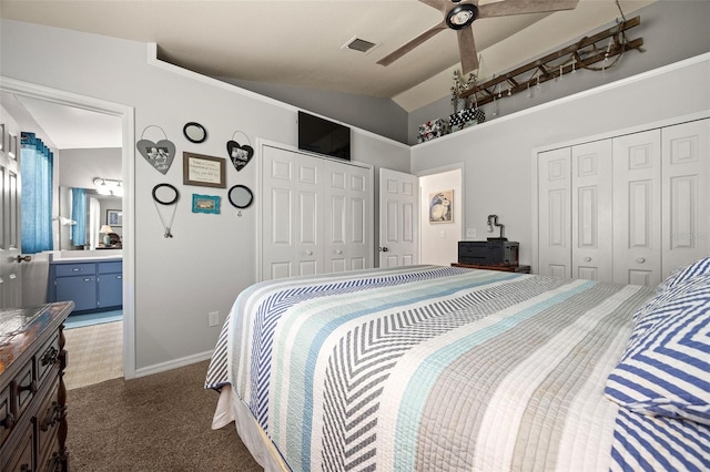 carpeted bedroom with ceiling fan, lofted ceiling, and ensuite bathroom