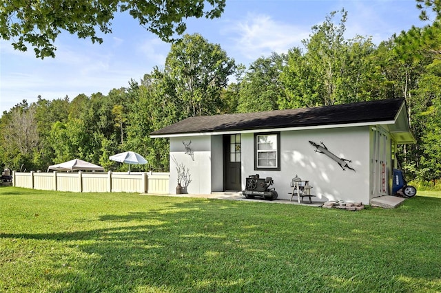 view of outbuilding featuring a yard