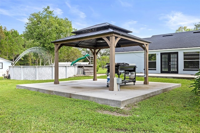 view of patio with french doors and a playground