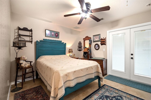 tiled bedroom featuring ceiling fan and french doors