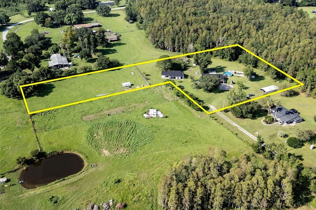 birds eye view of property featuring a rural view