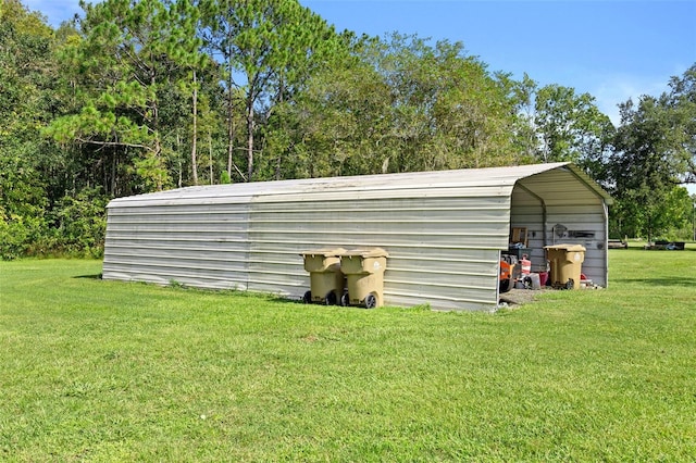 view of outdoor structure with a lawn and a carport