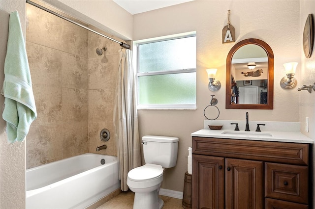 full bath with shower / tub combo, baseboards, toilet, tile patterned floors, and vanity