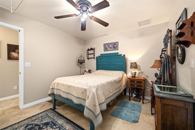 bedroom with attic access, visible vents, ceiling fan, and baseboards