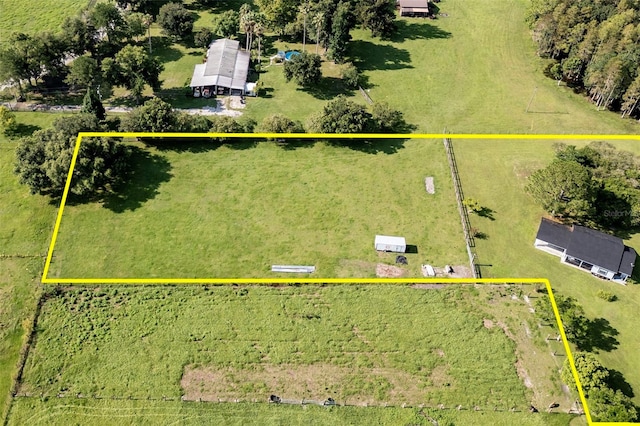 birds eye view of property featuring a rural view