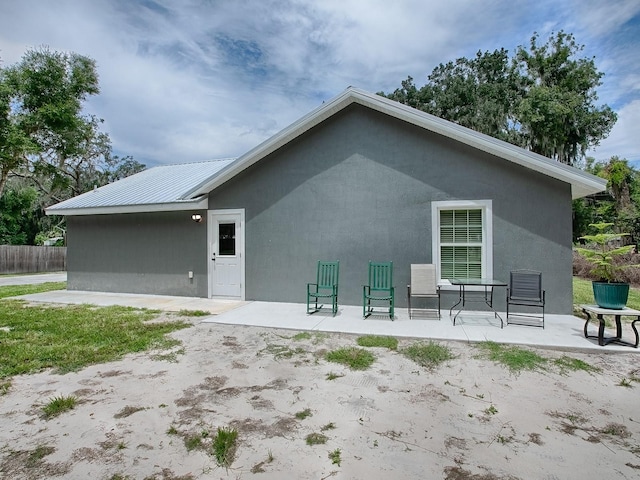 back of house featuring a patio area