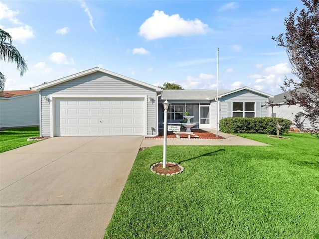 ranch-style house with a garage and a front lawn