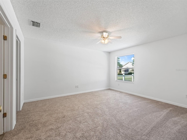 unfurnished bedroom featuring ceiling fan, carpet, and a textured ceiling