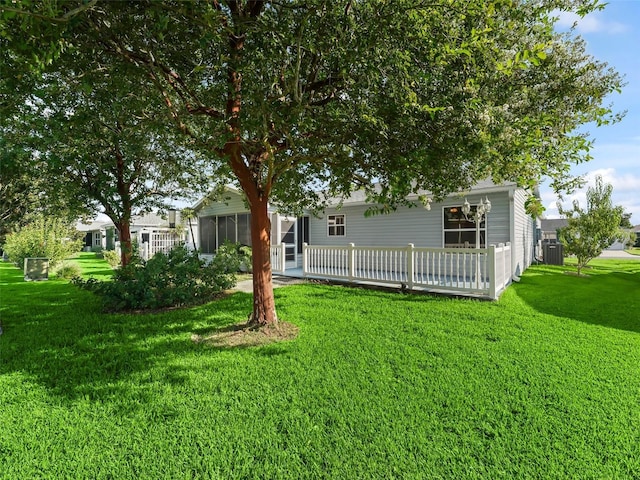 view of yard featuring a sunroom