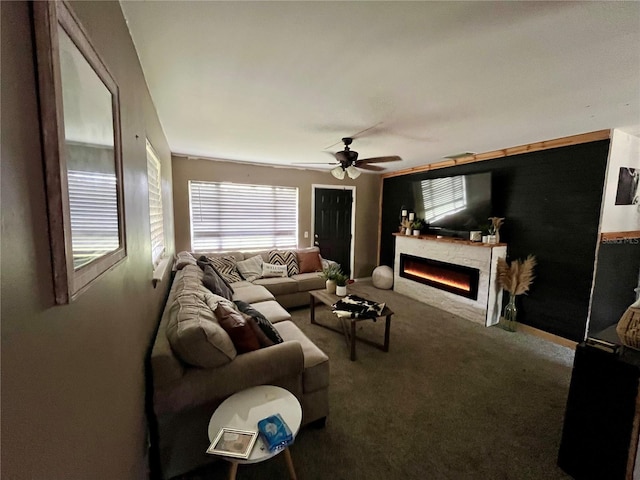 living room with ceiling fan and carpet floors