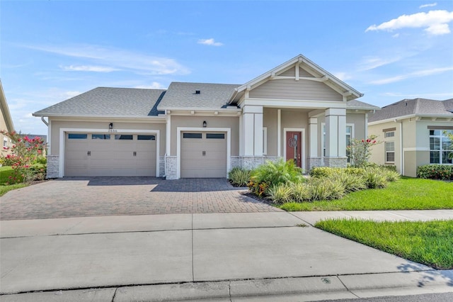 craftsman-style home with a garage