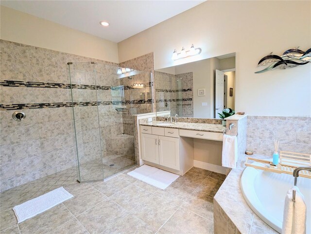 bathroom featuring vanity, tile patterned floors, and separate shower and tub