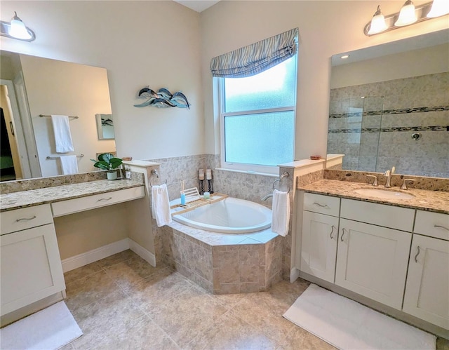 bathroom featuring vanity, shower with separate bathtub, and tile patterned flooring