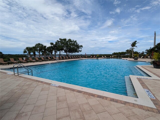 view of pool featuring a patio