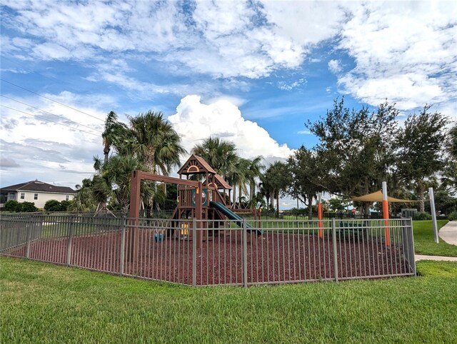 view of jungle gym with a lawn