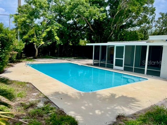 view of swimming pool featuring a patio area