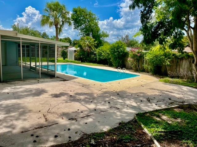 view of swimming pool with a patio