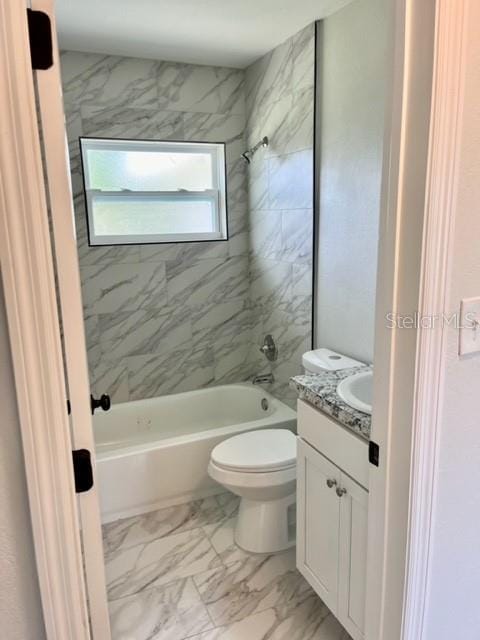 full bathroom featuring toilet, tile patterned floors, vanity, and tiled shower / bath