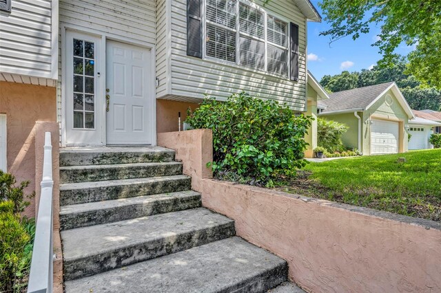 doorway to property featuring a garage