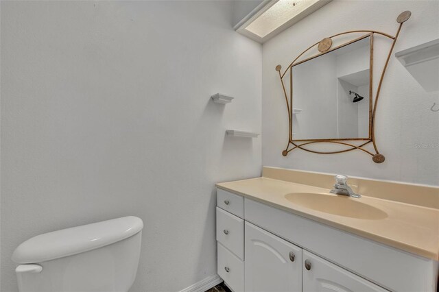 bathroom with toilet and vanity