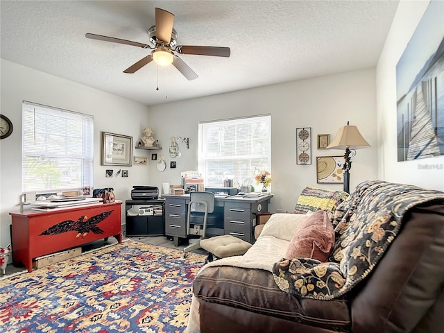 home office featuring a textured ceiling and ceiling fan